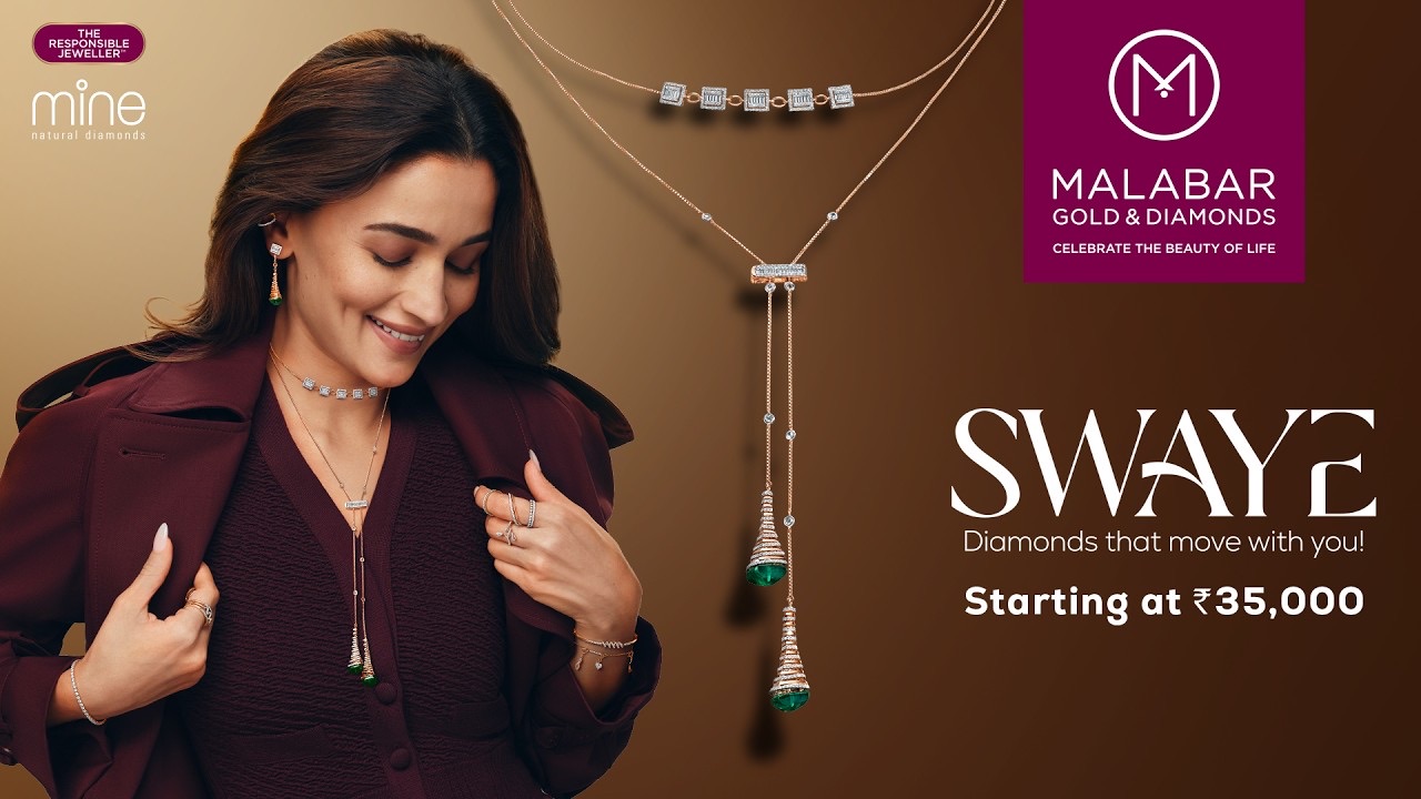 Alia Bhatt in a maroon jacket wears a long diamond necklace beside the Malabar Gold & Diamonds SWAYE logo, starting at Rs 35,000