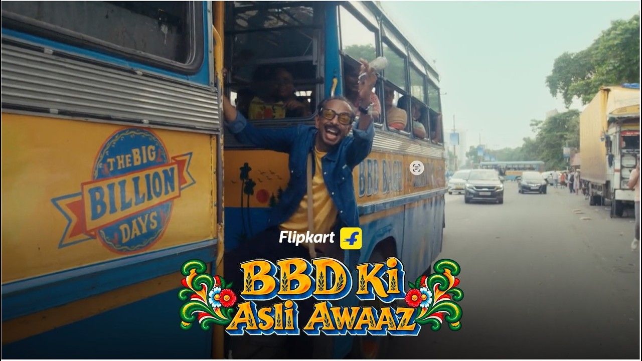 A Kolkata bus conductor leans out of a bus painted with the Big Billion Days logo, with the title "BBD Ki Asli Awaaz"